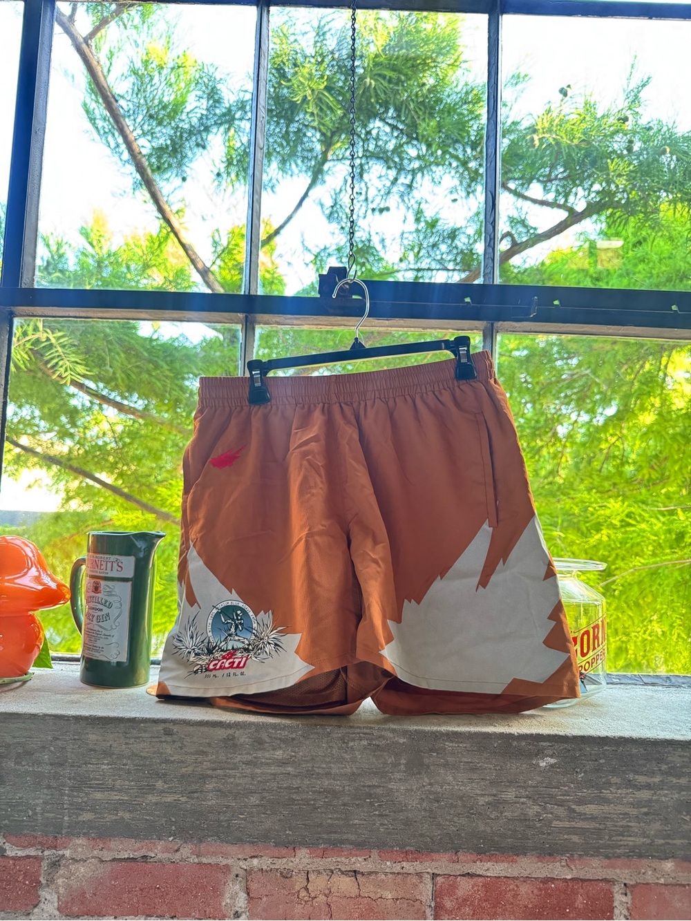 Travis Scott Rust Orange Graphic Athletic Shorts with White Accents